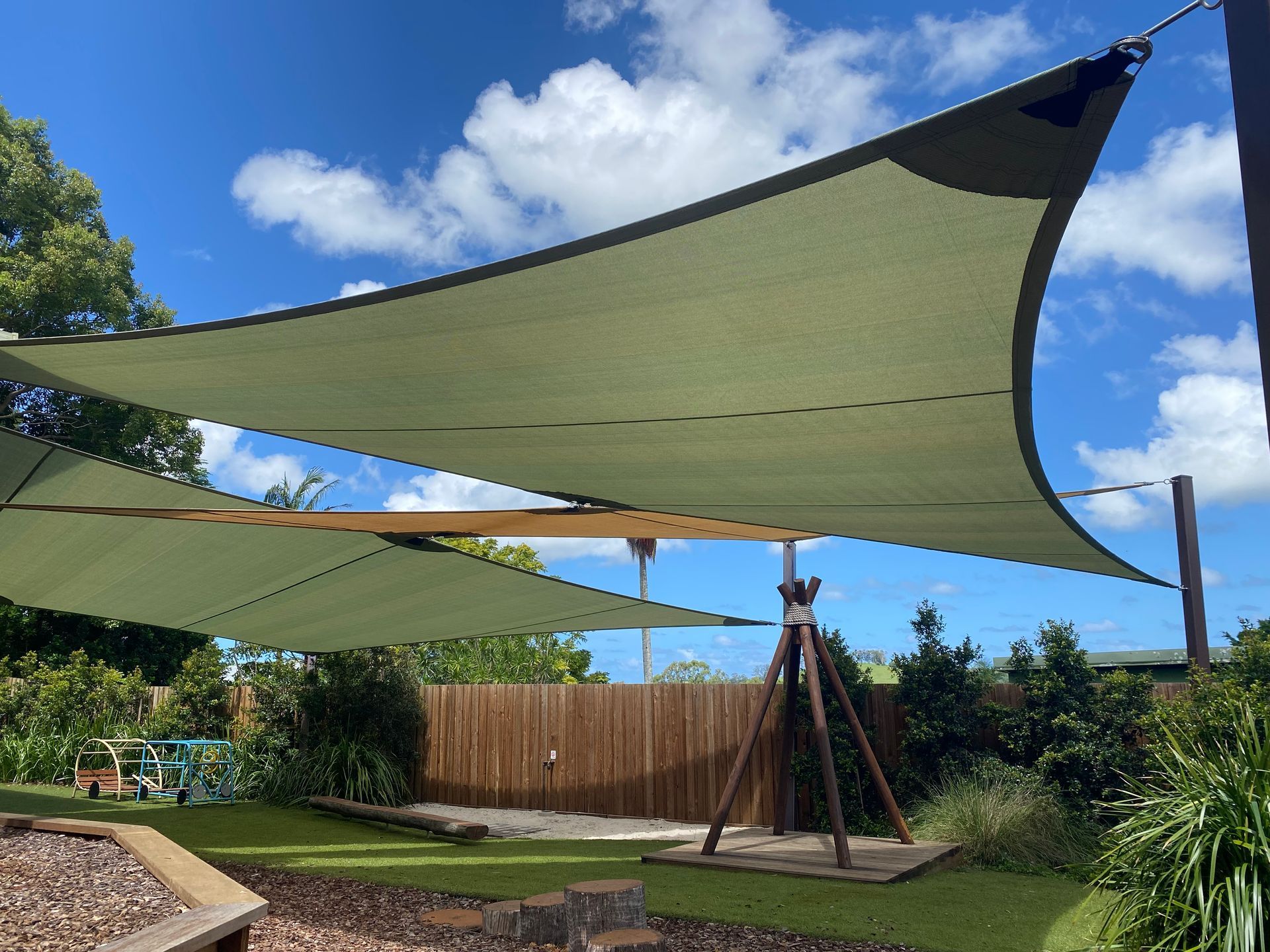 Olive-green shade sails over a childcare playground in Bangalow