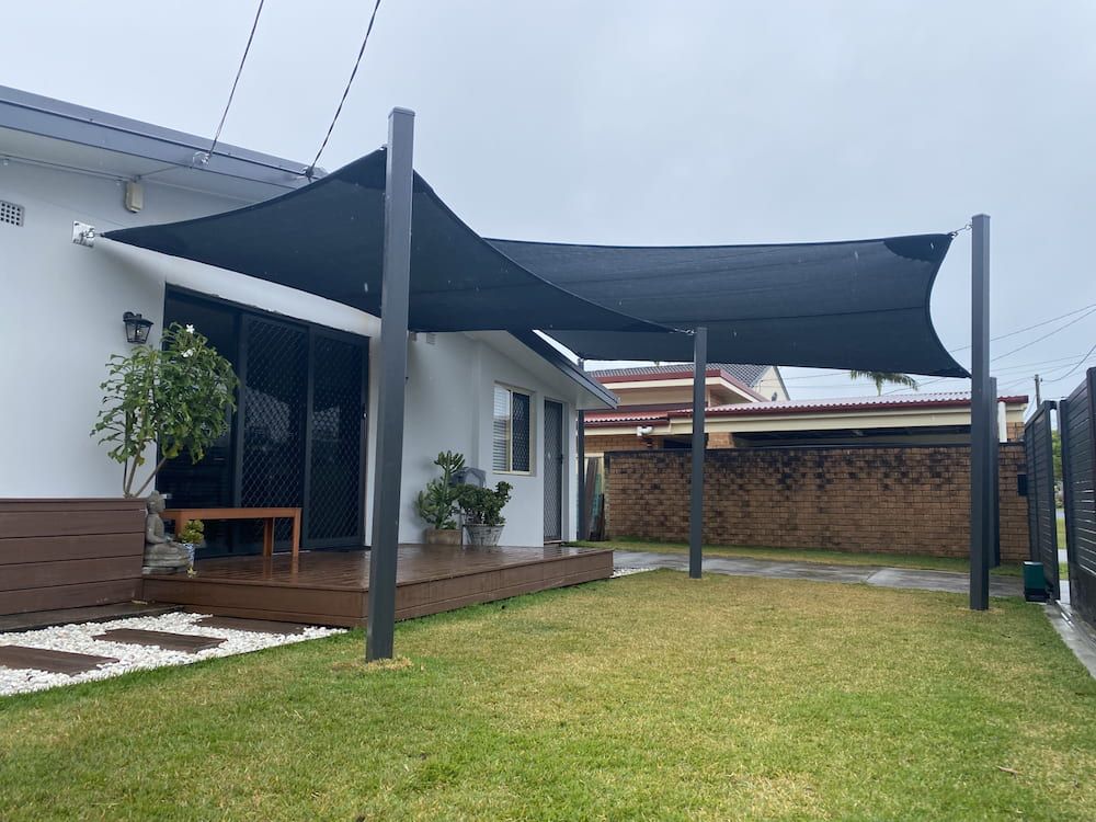 Shade sail over a deck and entertaining area at a Tugun home